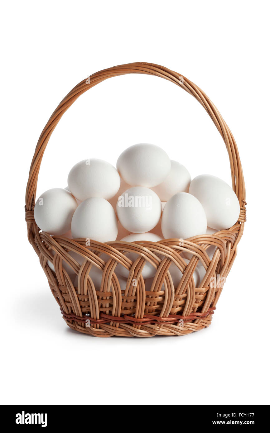 Basket with fresh white eggs on white background Stock Photo