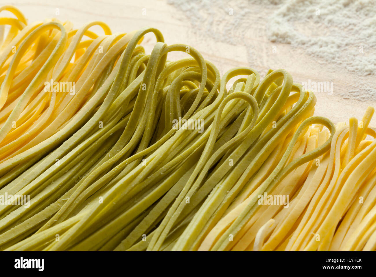 https://c8.alamy.com/comp/FCYHCK/fresh-tagliolini-bicolore-pasta-close-up-FCYHCK.jpg