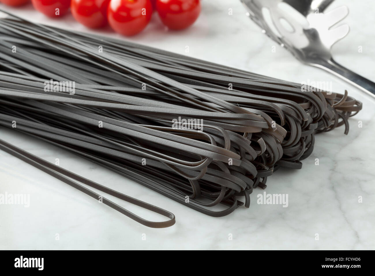 Raw black tinted traditional Italian spaghetti Stock Photo