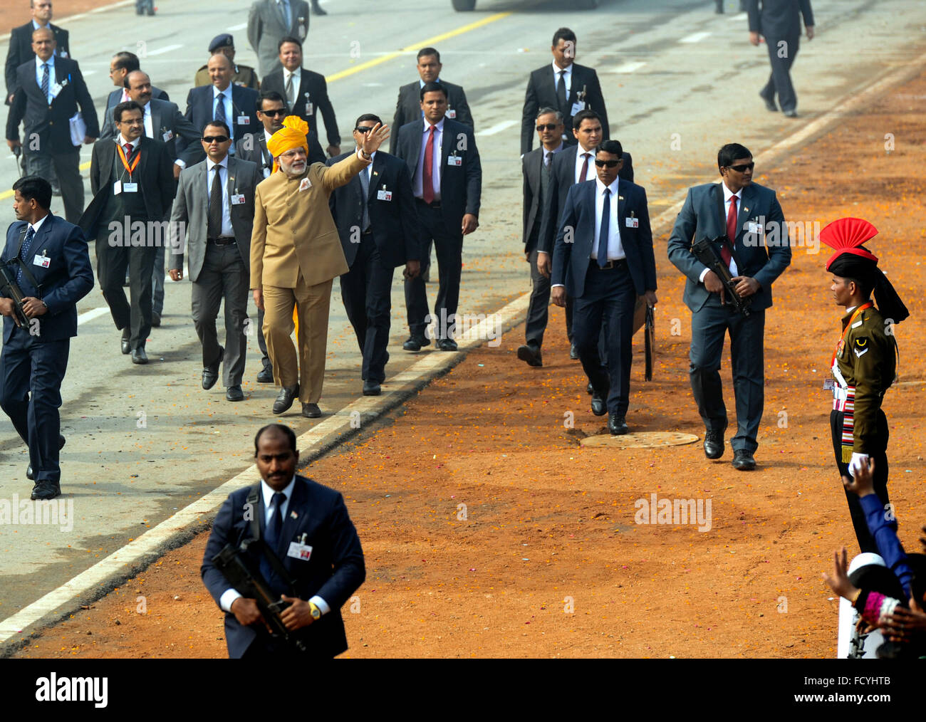 (160126) -- NEW DELHI, Jan. 26, 2016 (Xinhua) -- Indian Prime Minister Narendra Modi (in brown suit) waves towards the audience at the 67th Republic Day Parade in New Delhi, India, Jan. 26, 2016. Republic Day marks the anniversary of India's democratic constitution taking force in 1950. (Xinhua) Stock Photo