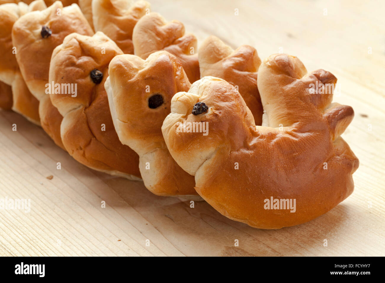 Row of traditional palm sunday rolls in the shape of a rooster Stock Photo