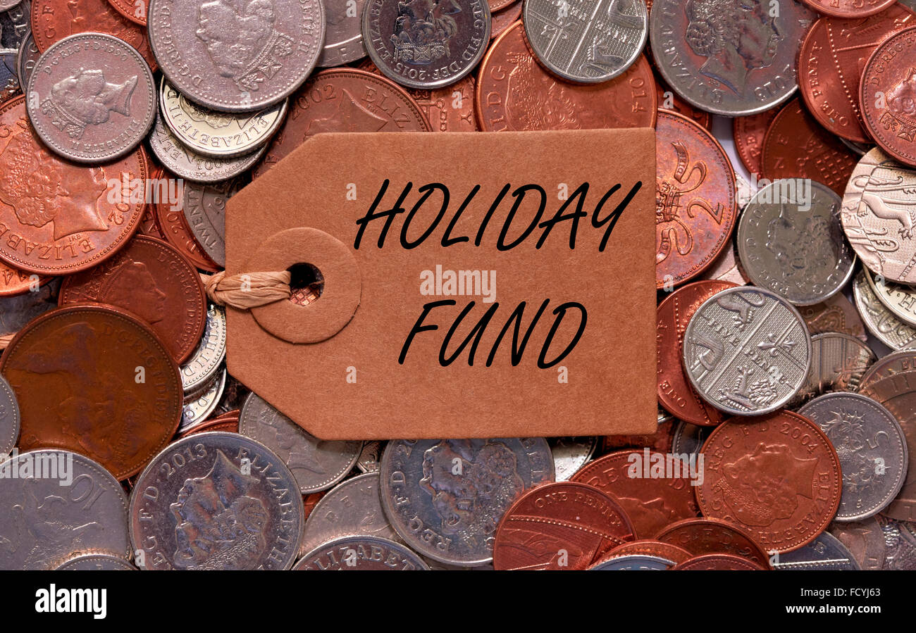 Holiday fund label on British mixed coins Stock Photo
