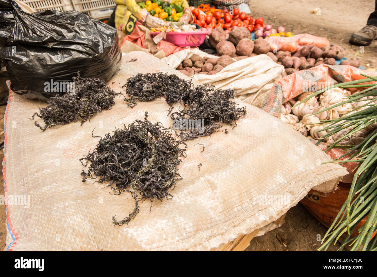 Mococho, a type of seaweed that is used as a garnish in Peruvian dishes, on sale at a street market stall in Cajabamba, Peru. Stock Photo