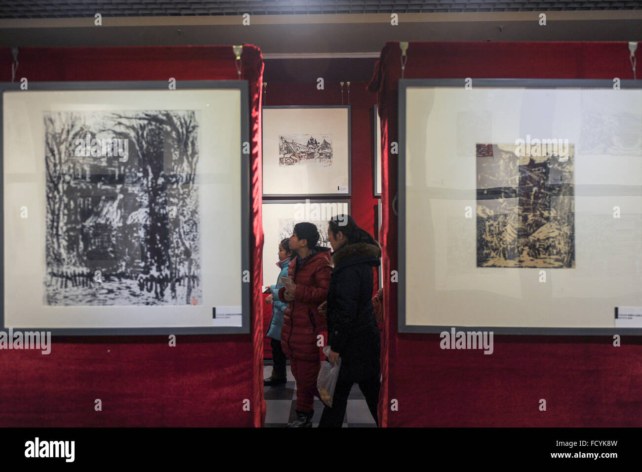 Harbin, China's Heilongjiang Province. 26th Jan, 2016. People visit an exhibition of ice engraving painting in Harbin, capital of northeast China's Heilongjiang Province, Jan. 26, 2016. The pictures on display were printed from engraved ice slabs, according to artist Zhu Xiaodong. He said each ice slab was able to print out some 20 pages yielding variant results as the ice melted down. © Wang Song/Xinhua/Alamy Live News Stock Photo