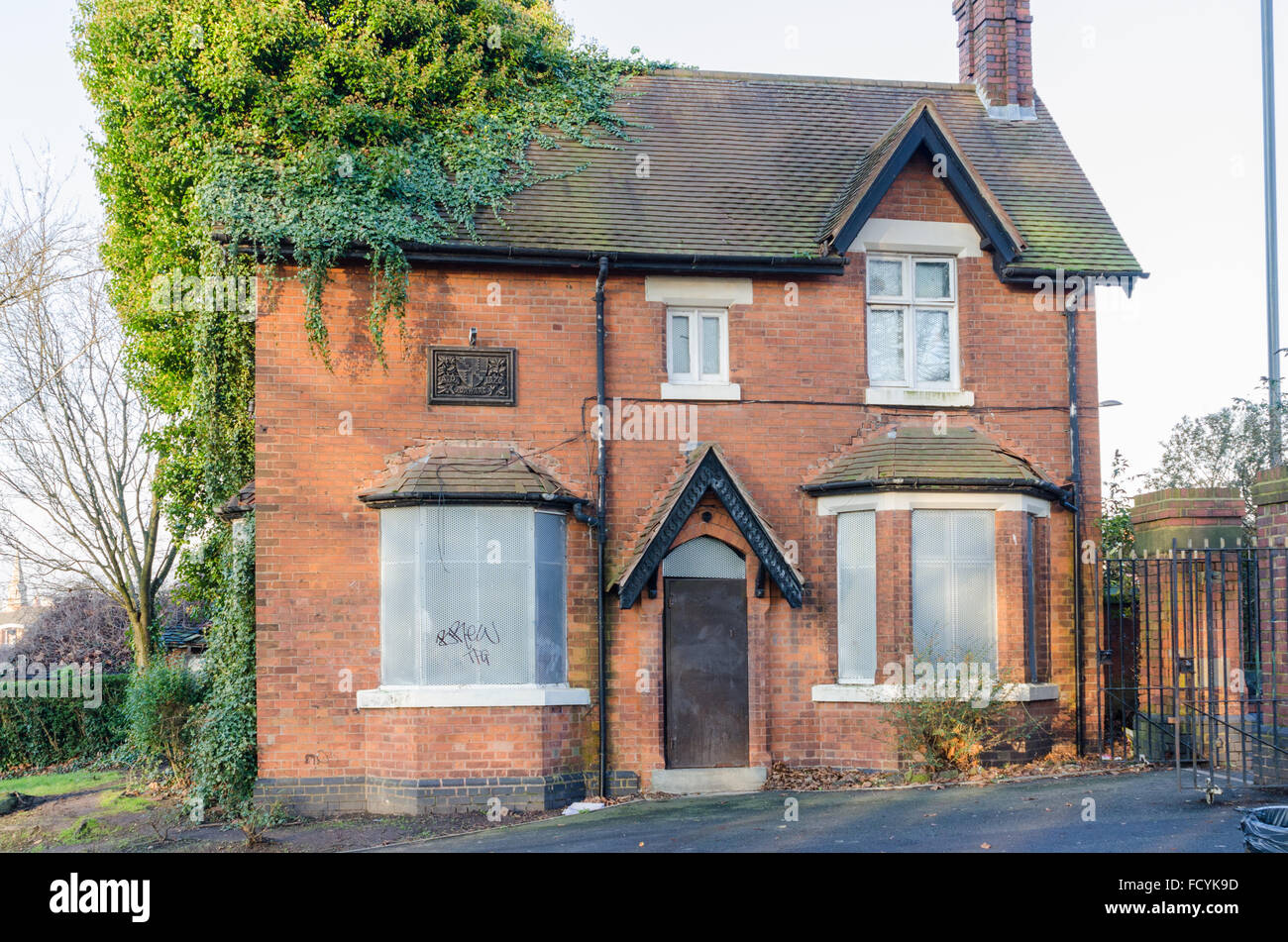 Boarded up victorian gate house at entrance to Highgate Park in