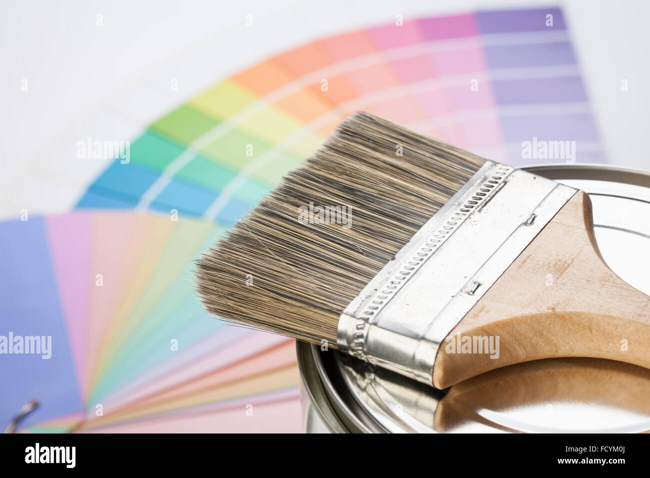 Paint brush on paint pot with the background of color scheme Stock Photo