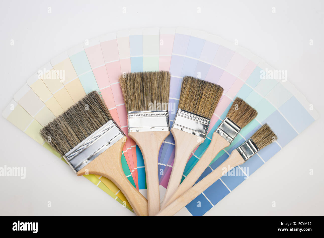 Different size of paint brushes on color scheme Stock Photo