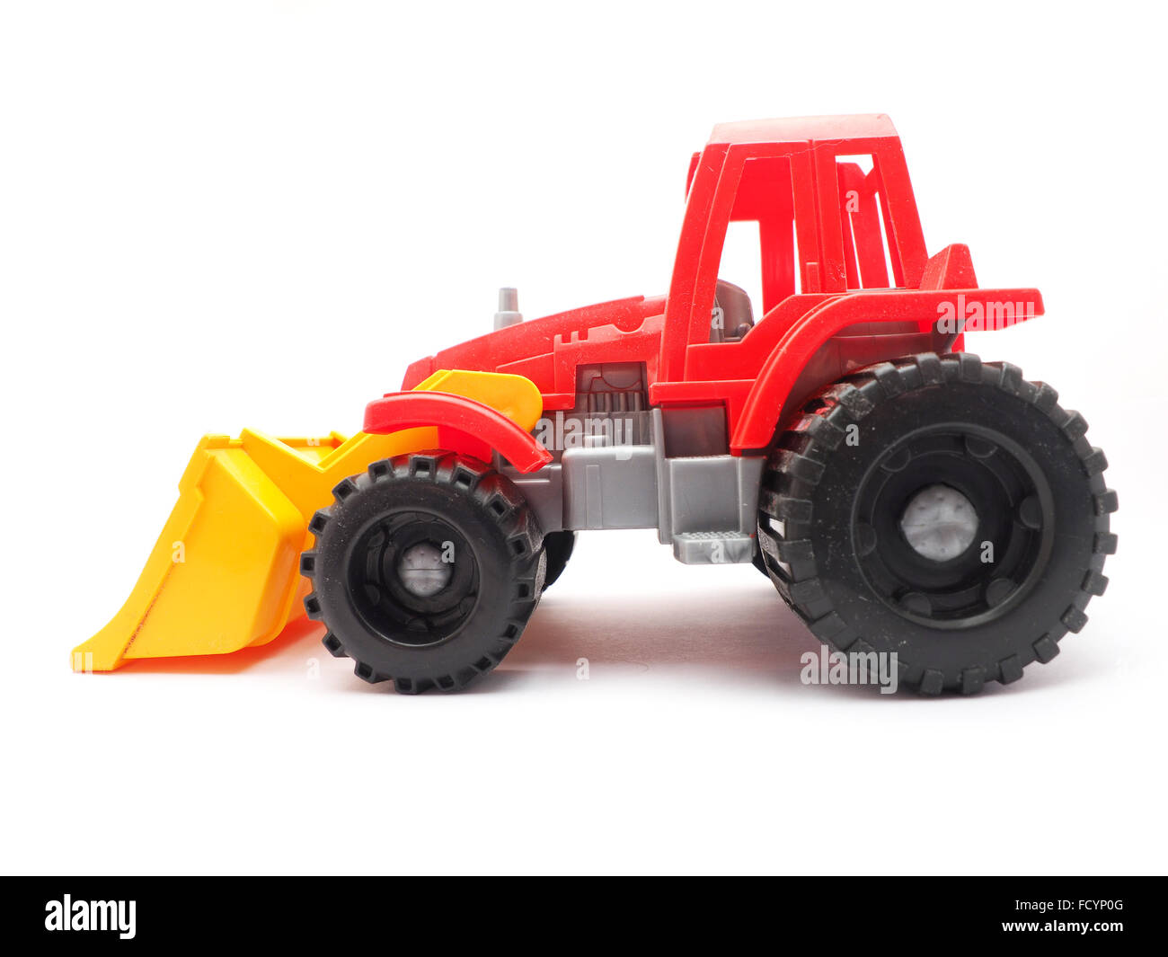 toy tractor on a white background Stock Photo - Alamy