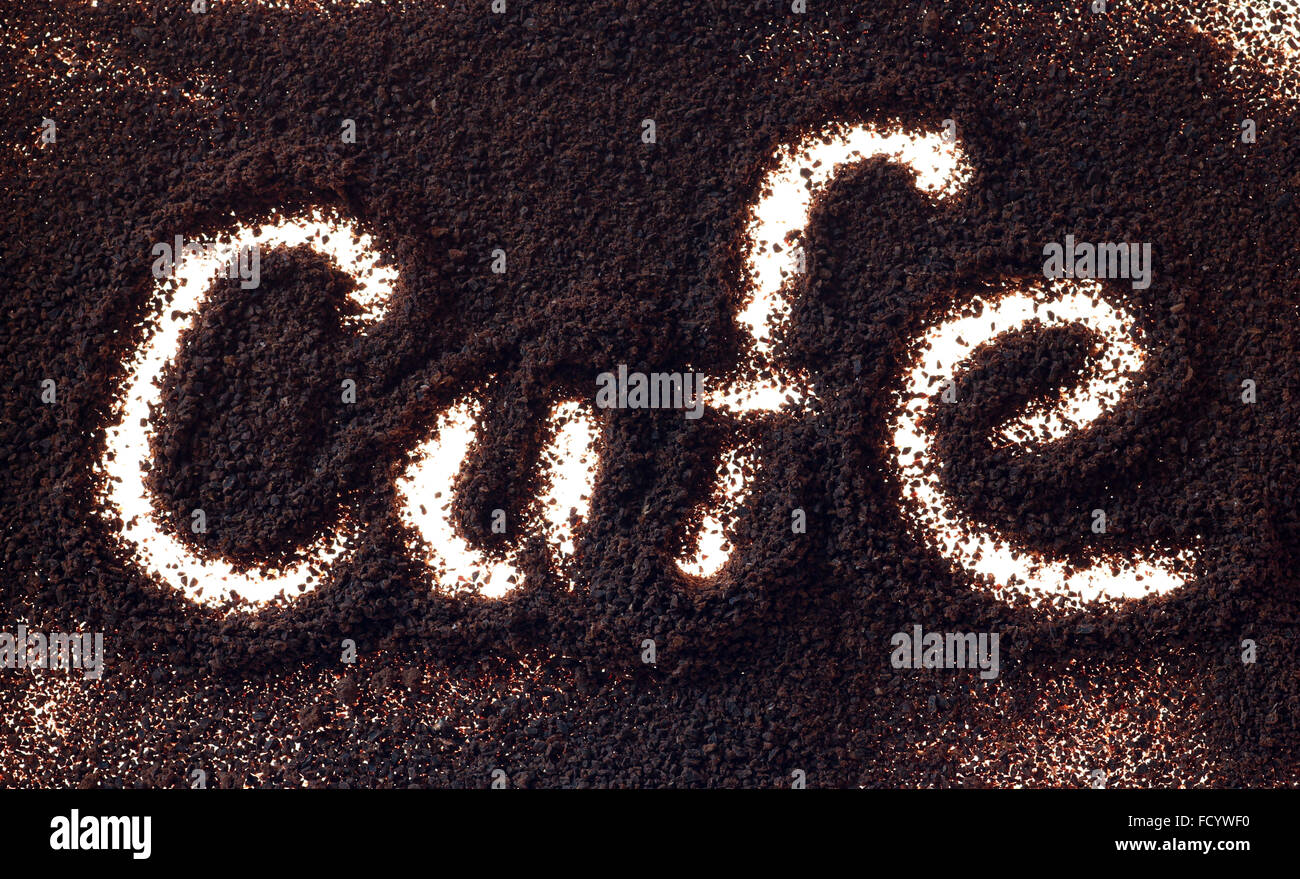 word cafe backlit in coffee grounds Stock Photo