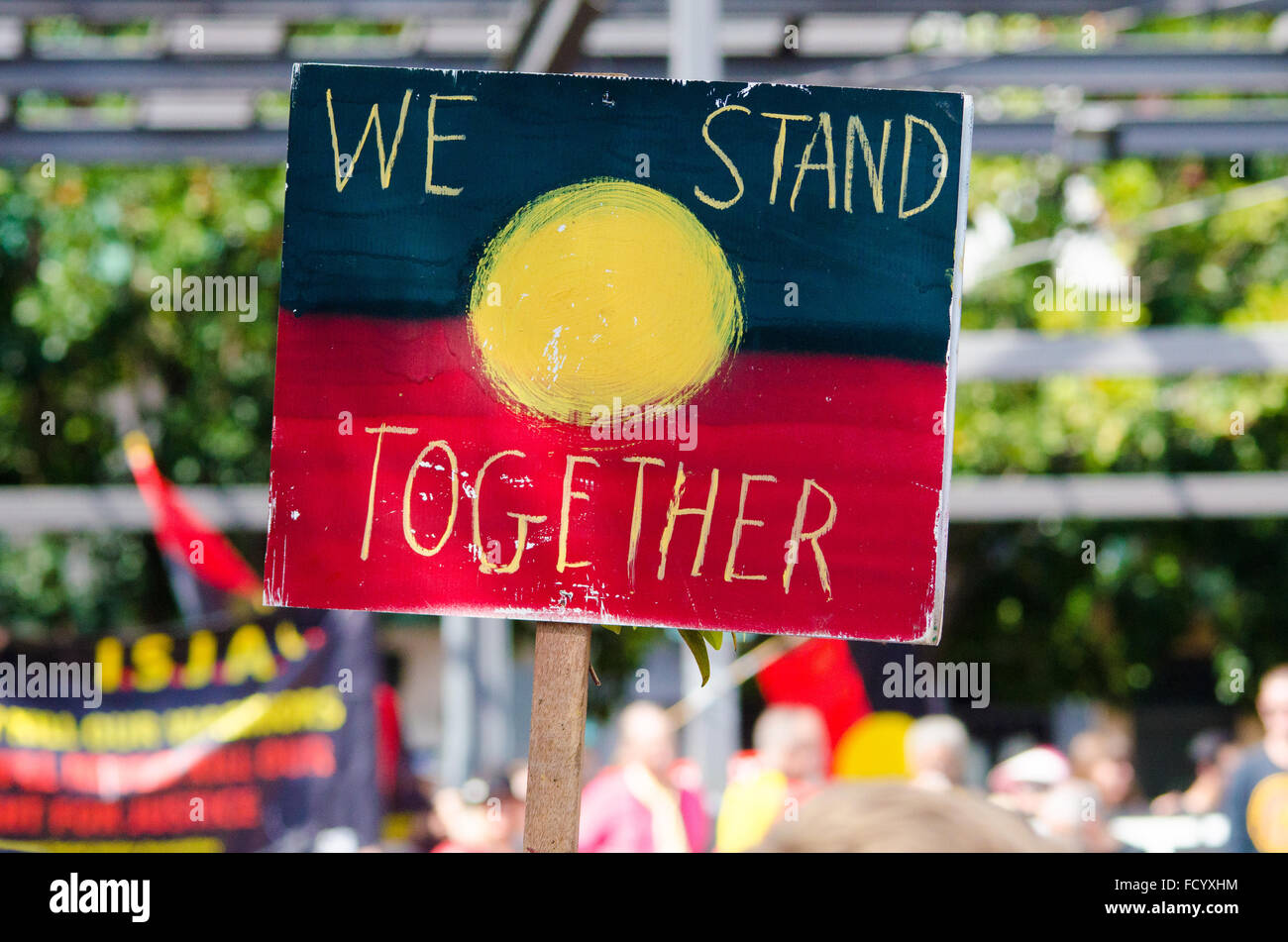 Sydney, Australia. 26th January, 2016. The Sydney Invasion Day March Protest brought together Aboriginal people and supporters voicing their opinions about Aboriginal land / culture. The march started at The Block in Redfern and then moved to Sydney's Town Hall. The date is also celebrated as Australia Day marking the arrival of the First Fleet. Credit:  mjmediabox/Alamy Live News Stock Photo