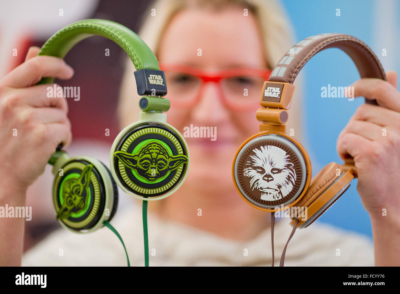 Nuremberg, Germany. 26th Jan, 2016. Headphones by manufacturer Jazwares featuring the Star Wars film characters Yoda (l) and Chewbacca, pictured during the new products show at the 67th international toys trade fair (Spielwarenmesse) in Nuremberg, Germany, 26 January 2016. The world's largest toys trade fair runs from 27 January to 1 February 2016. PHOTO: DANIEL KARMANN/DPA/Alamy Live News Stock Photo