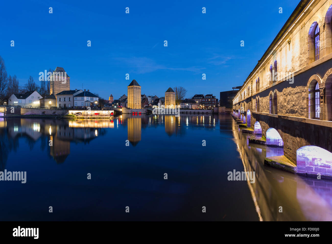 Illuminated Barrage Vauban and Ponts Couverts at twilight Strasbourg, Alsace,  France Stock Photo