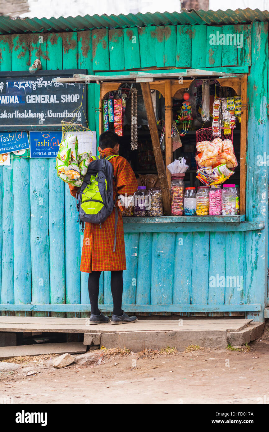 Schoolboy at General Shop, Jakar, Bumthang, Central Bhutan, Asia Stock Photo