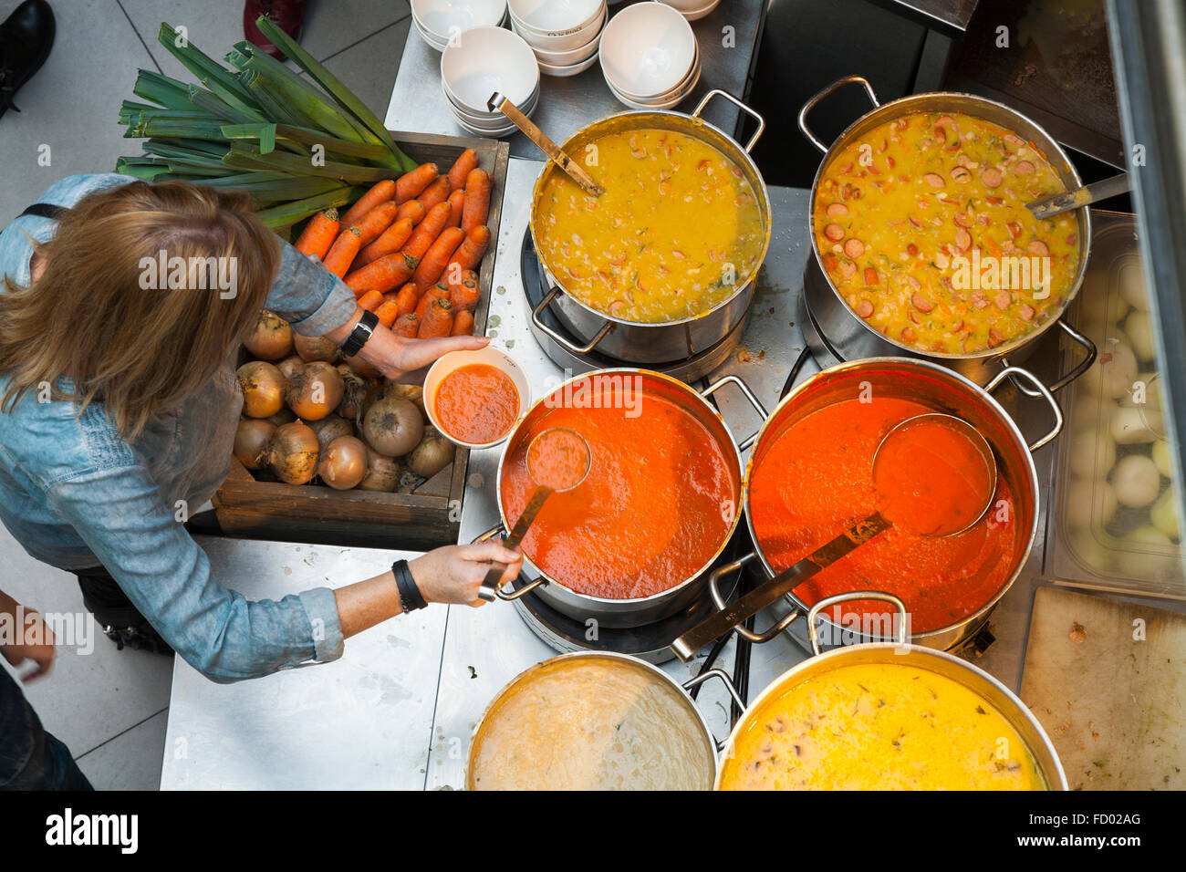 Customers serve themselves with hot soup at La Place self service food