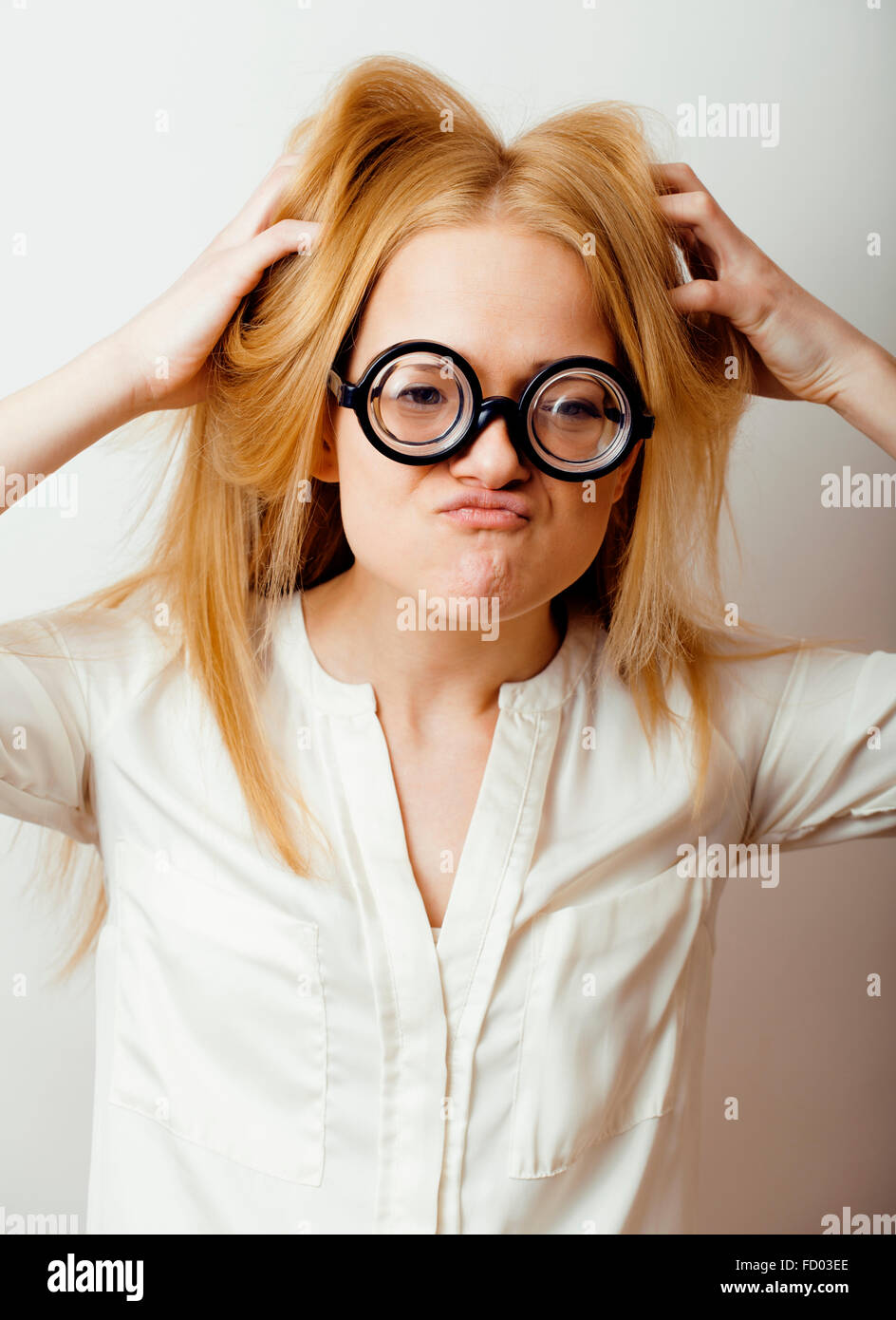 young-blond-teenage-girl-in-big-glasses-fool-around-having-fun-student-FD03EE.jpg