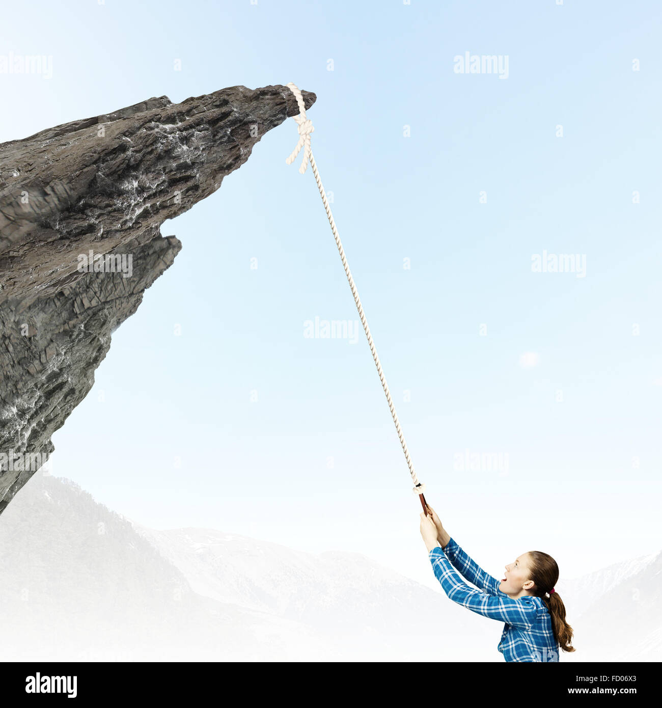 Climbing Help With Rope Young woman climbing rock with help of rope Stock Photo - Alamy