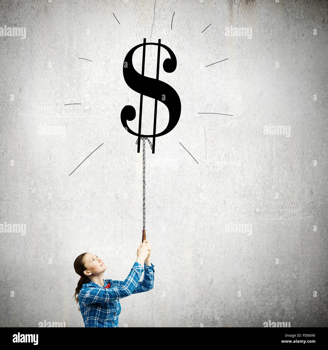 Young woman holding balloon shaped like dollar sign Stock Photo - Alamy