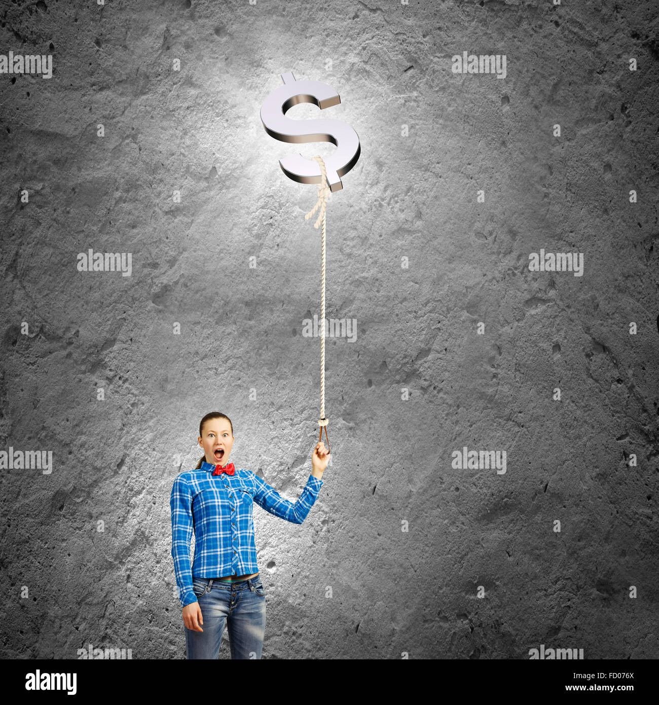 Young woman holding balloon shaped like dollar sign Stock Photo - Alamy