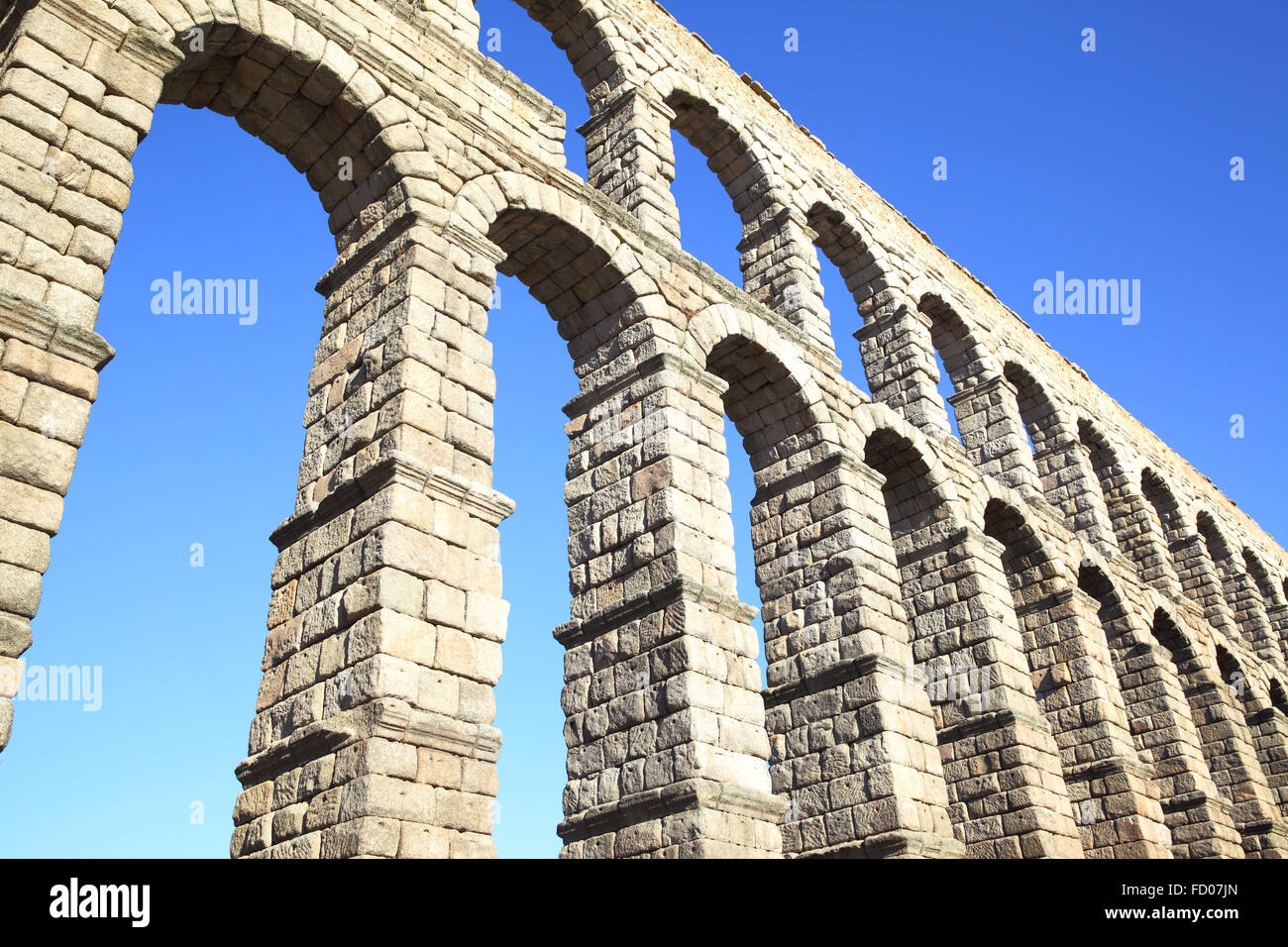 Perspective of ancient roman aqueduct in Segovia, Spain Stock Photo