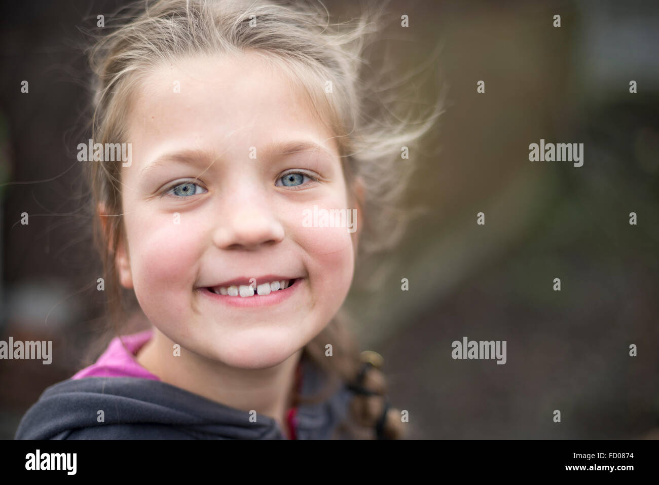 headshot of happy child girl smiling outdoor Stock Photo