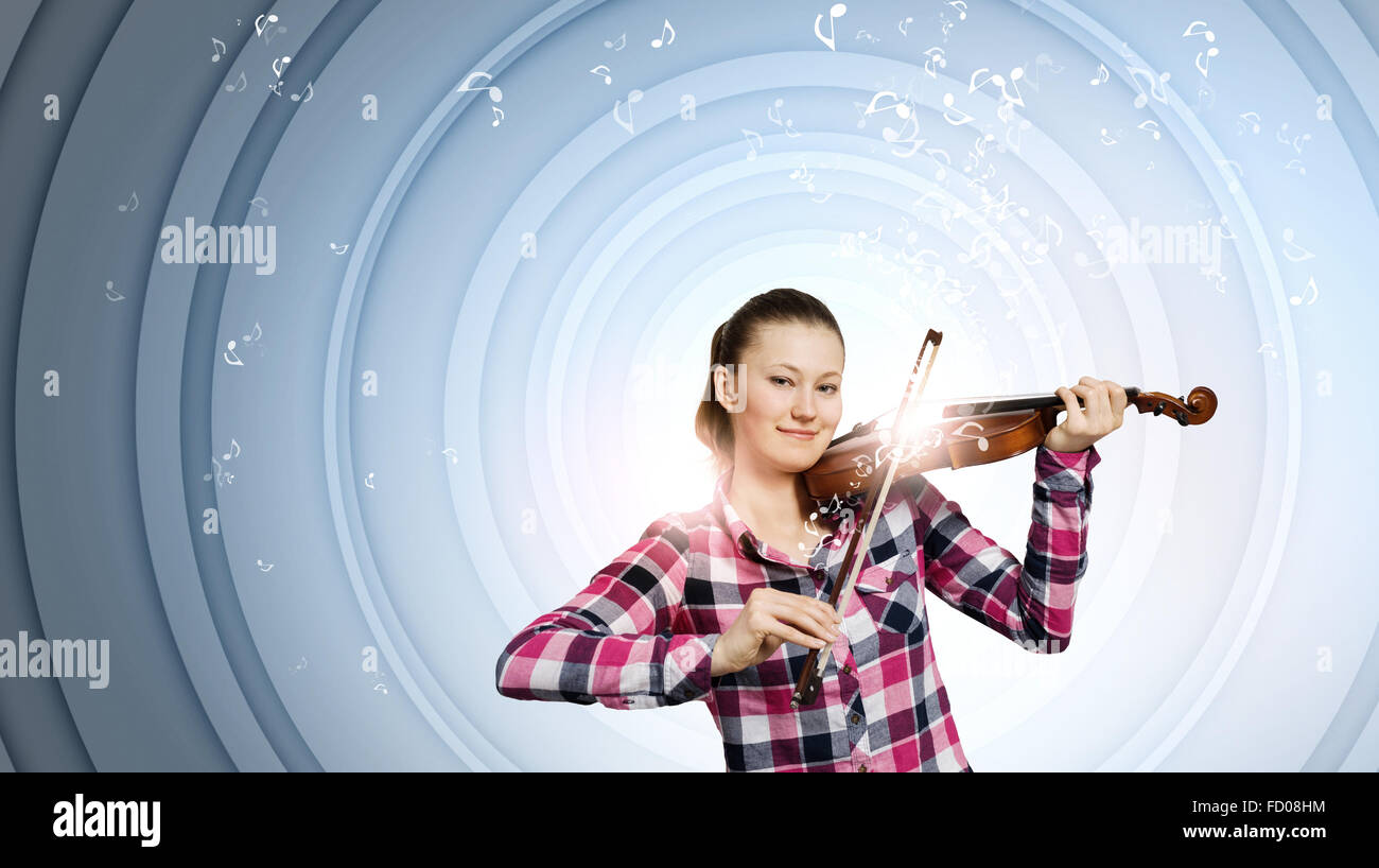 Young pretty woman in casual playing on violin Stock Photo - Alamy