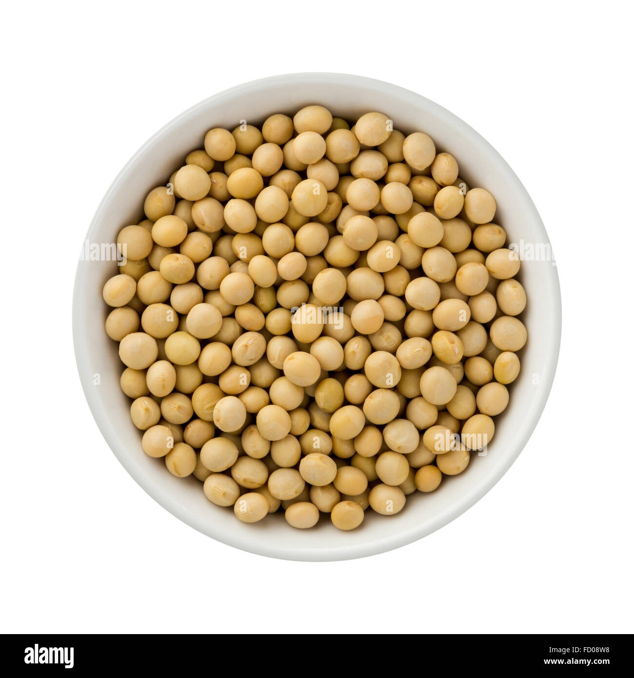 Soybeans in a ceramic bowl. The image is a cut out, isolated on a white background. Stock Photo