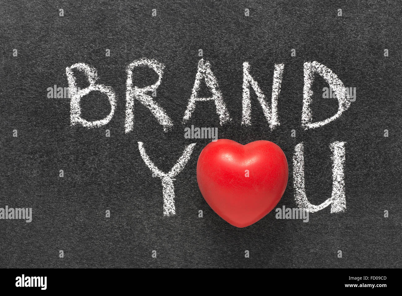 brand you phrase handwritten on blackboard with heart symbol instead of O Stock Photo