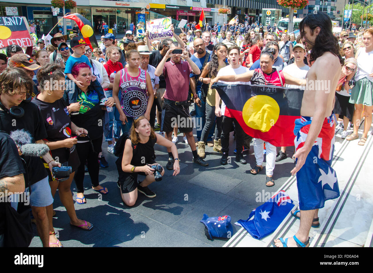 Sydney, Australia - 26th January 2016: The Sydney Invasion Day March Protest brought together Aboriginal people and supporters voicing their opinions about Aboriginal land / culture. The march started at The Block in Redfern and then moved to Sydney's Town Hall. The date is also celebrated as Australia Day marking the arrival of the First Fleet. Credit:  mjmediabox/Alamy Live News Stock Photo