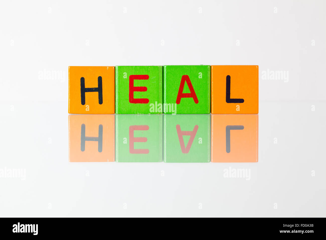 Heal  - an inscription from children's wooden blocks Stock Photo