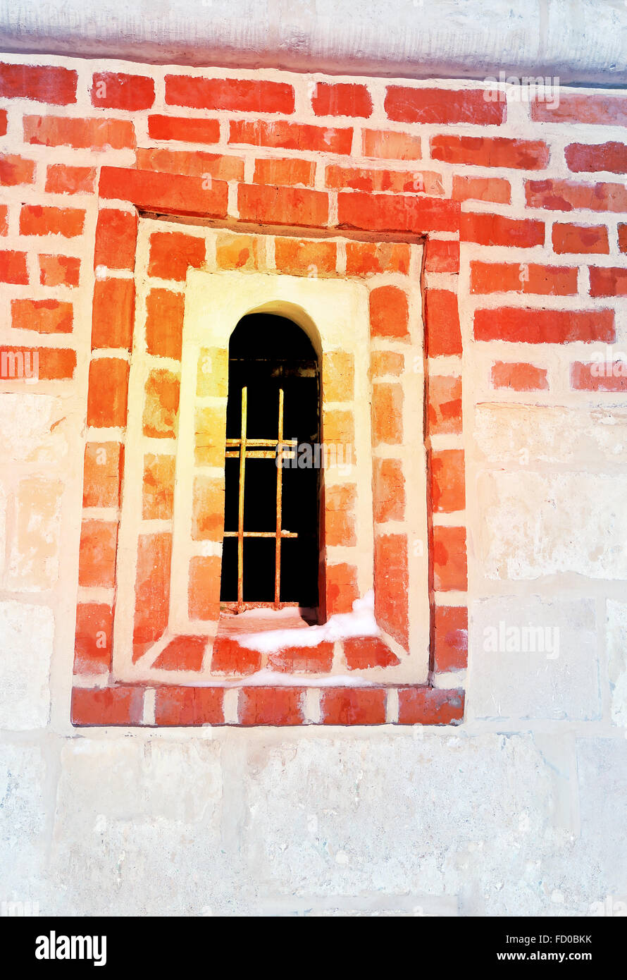 Small Windows in the fortress of red brick photographed close up Stock Photo