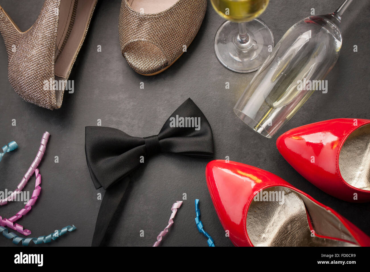 Bow tie, red heels, wine glasses, and ribbons Stock Photo Alamy