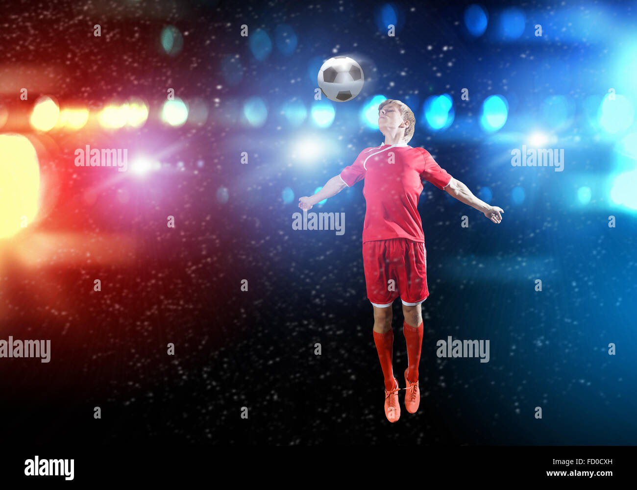 Young football player on stadium kicking ball Stock Photo Alamy
