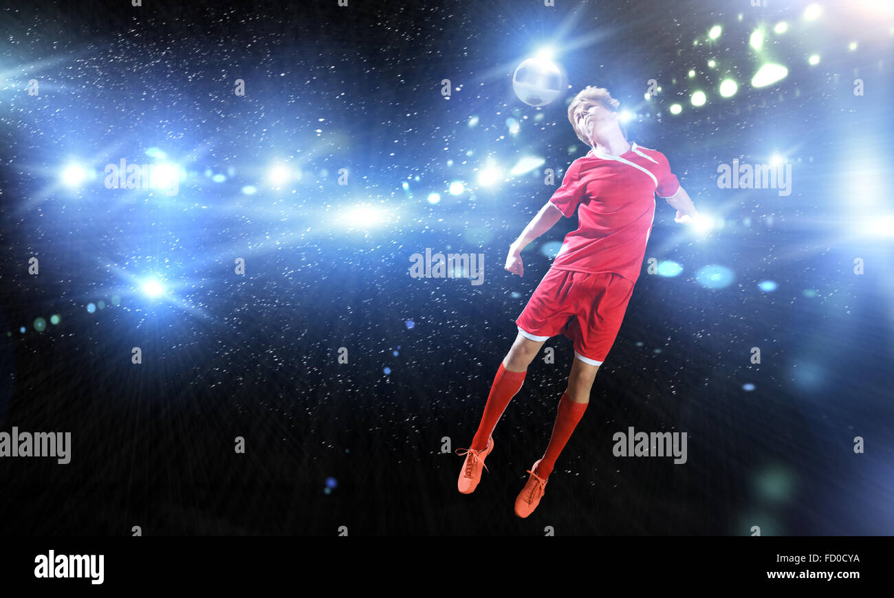Young football player on stadium kicking ball Stock Photo Alamy