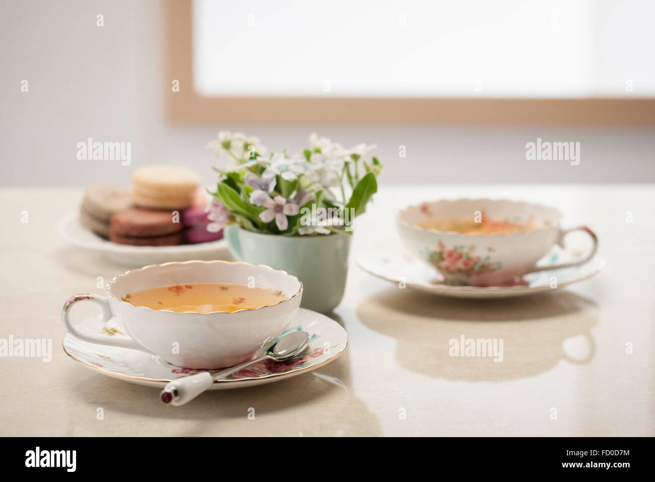 Set of tea table with flower decoration Stock Photo