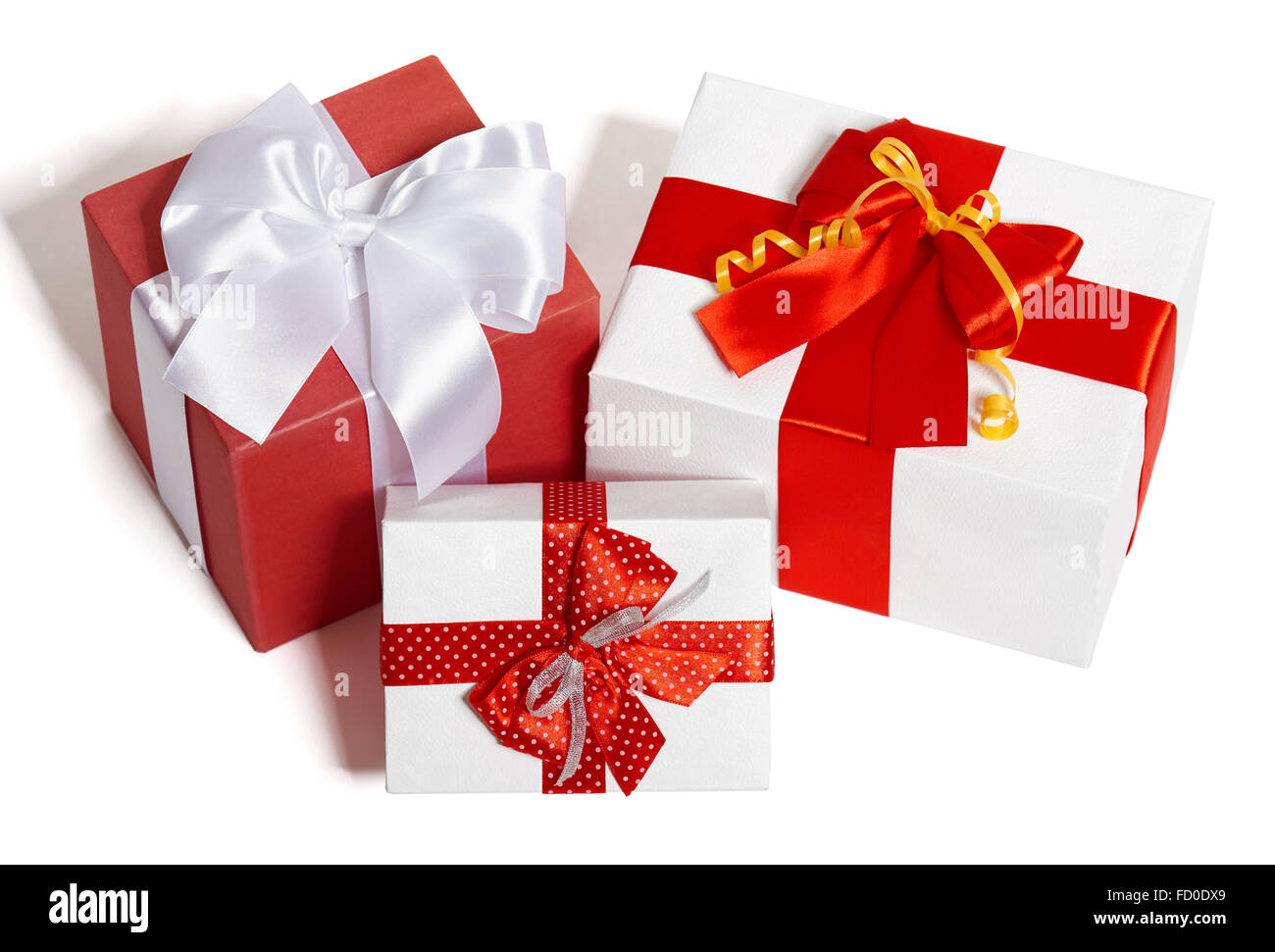 gifts boxes with ribbon and bow on white background, a group of three ...