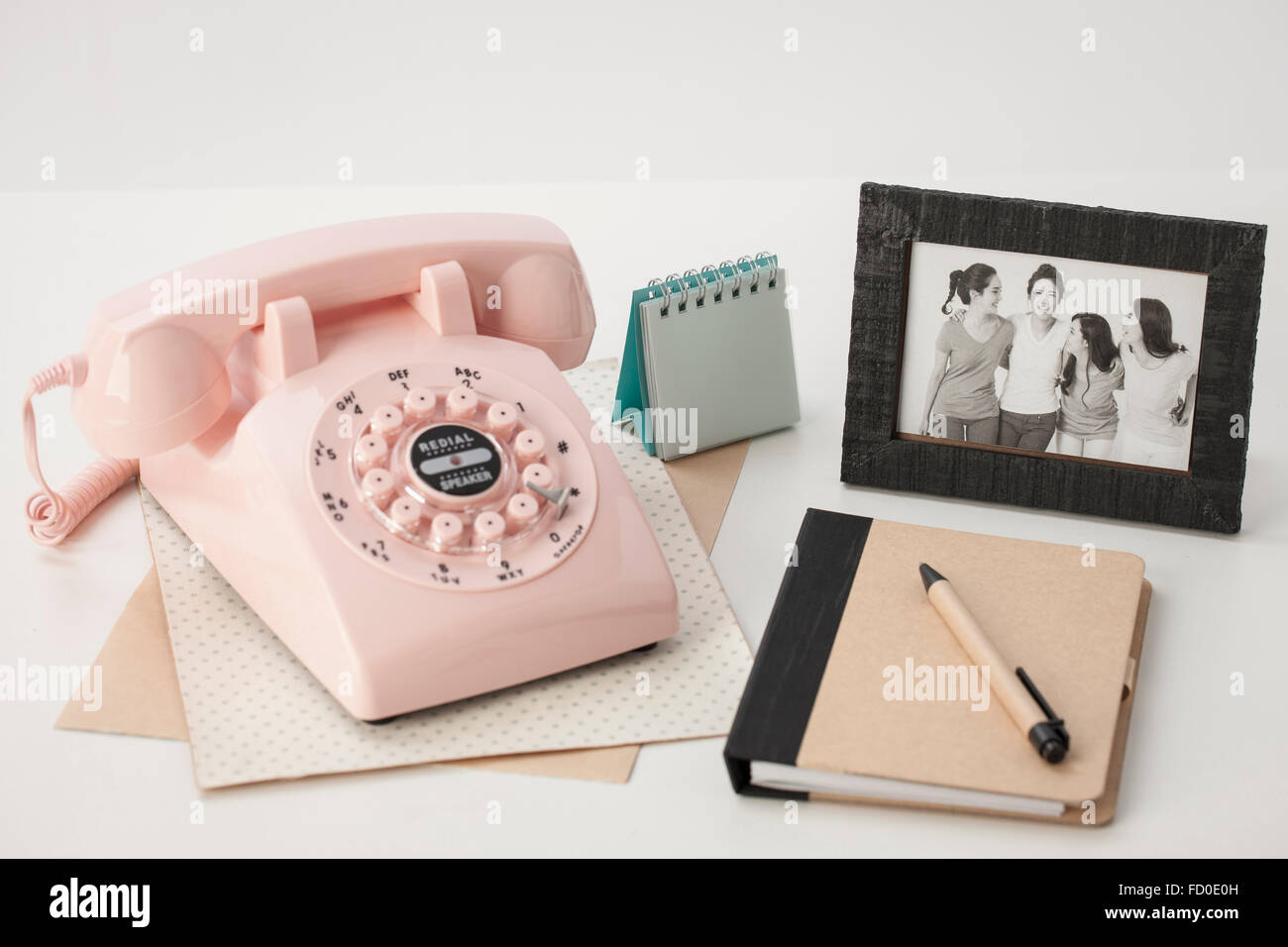 Analogue objects of telephone, diary, and old photo in a frame Stock Photo