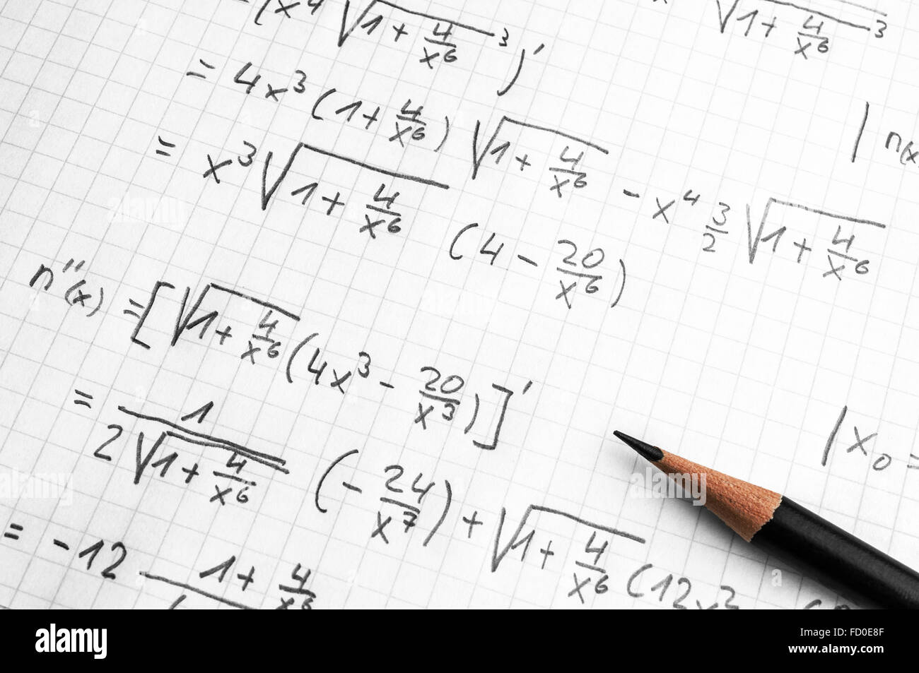 Maths concept - pencil over a sheet of paper with maths-formulas Stock ...