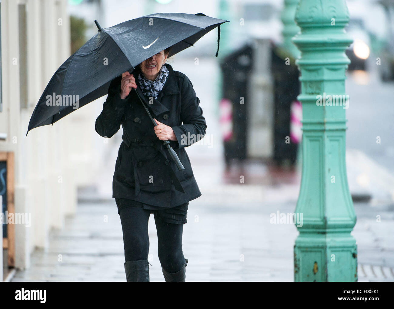Brighton, Sussex, UK. 26th January, 2016. UK Weather: The storm which has caused snow chaos in America arrives in the UK today bringing heavy rain and high winds. Scenes of people battling the elements in Brighton, Sussex, UK. Picture taken 26/01/2016   Credit:  Darren Cool/Alamy Live News Stock Photo