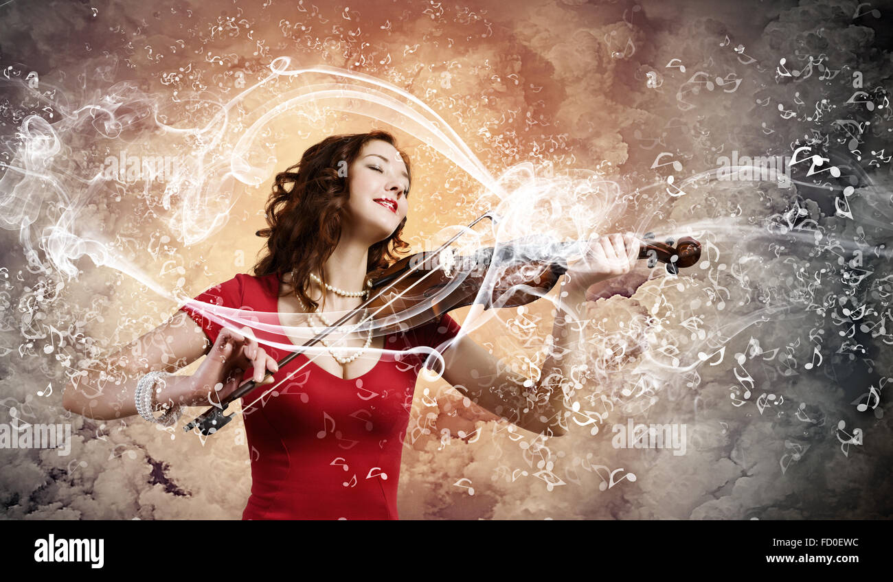 Young attractive woman in red dress playing violin Stock Photo - Alamy