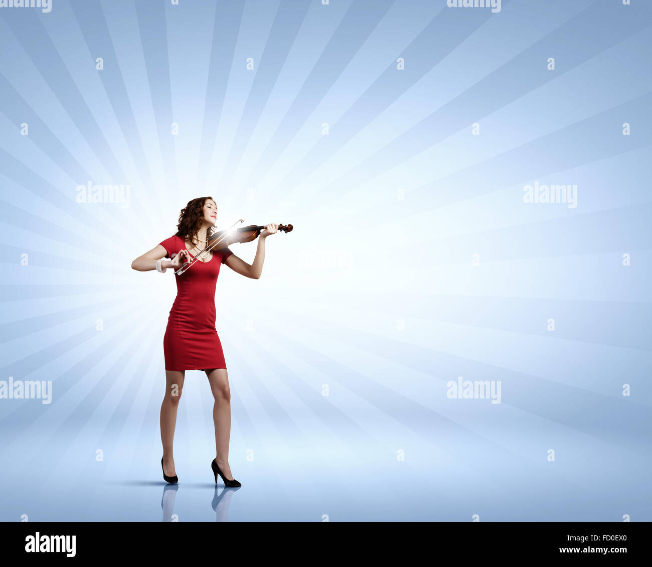 Young attractive woman in red dress playing violin Stock Photo - Alamy