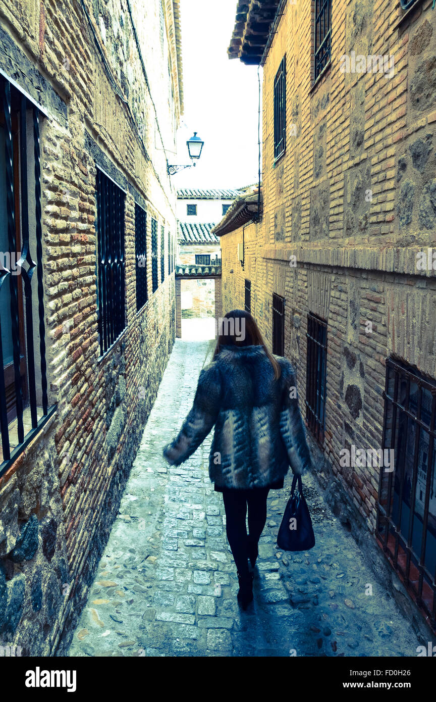 Full Length Rear View Of Fashionable Woman Walking Alone In Alley ...