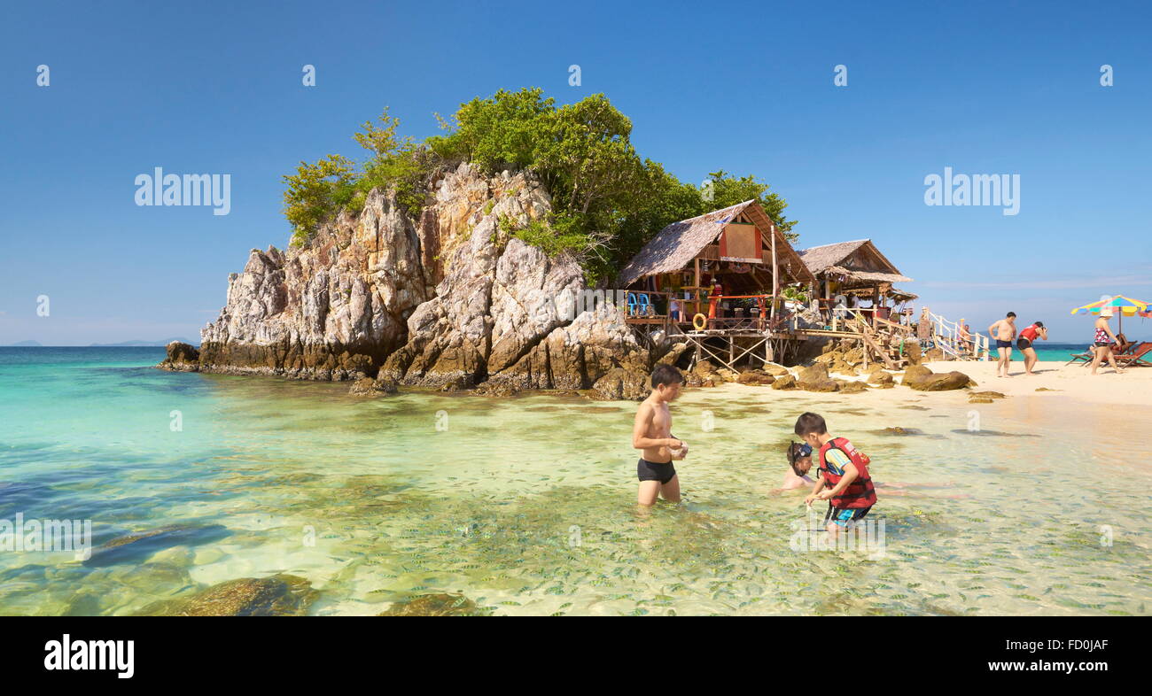 Thailand - tropical Khai Island, Phang Nga Bay, turists feeding fish in the shallow water Stock Photo