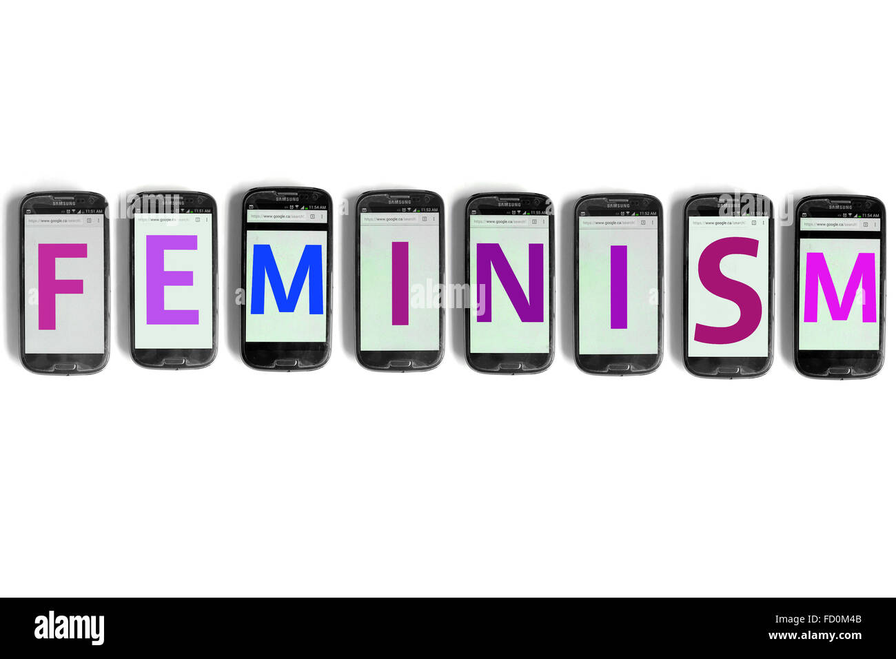 Feminism on the screens of smartphones photographed against a white background. Stock Photo