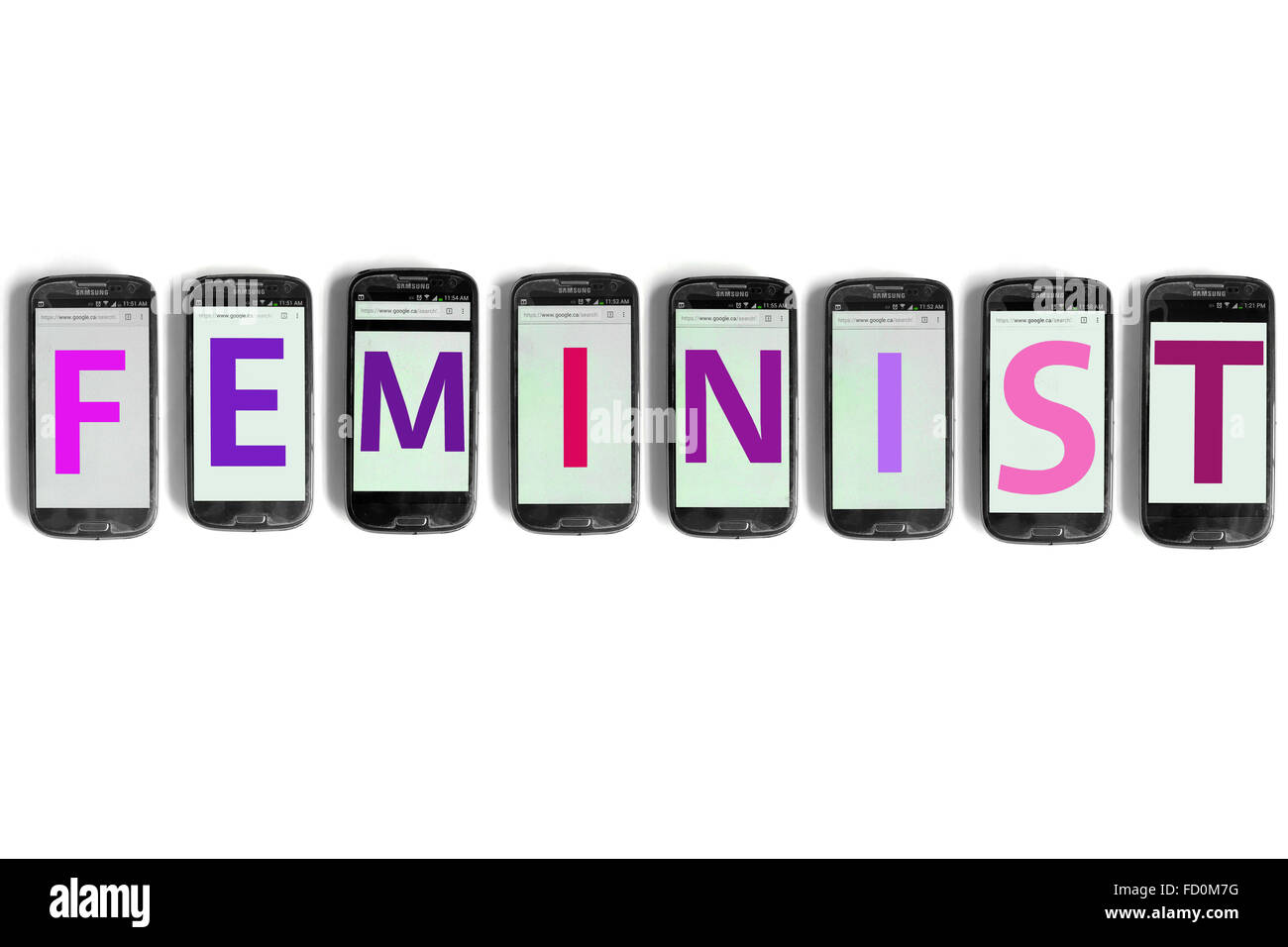 Feminist  on the screens of smartphones photographed against a white background. Stock Photo