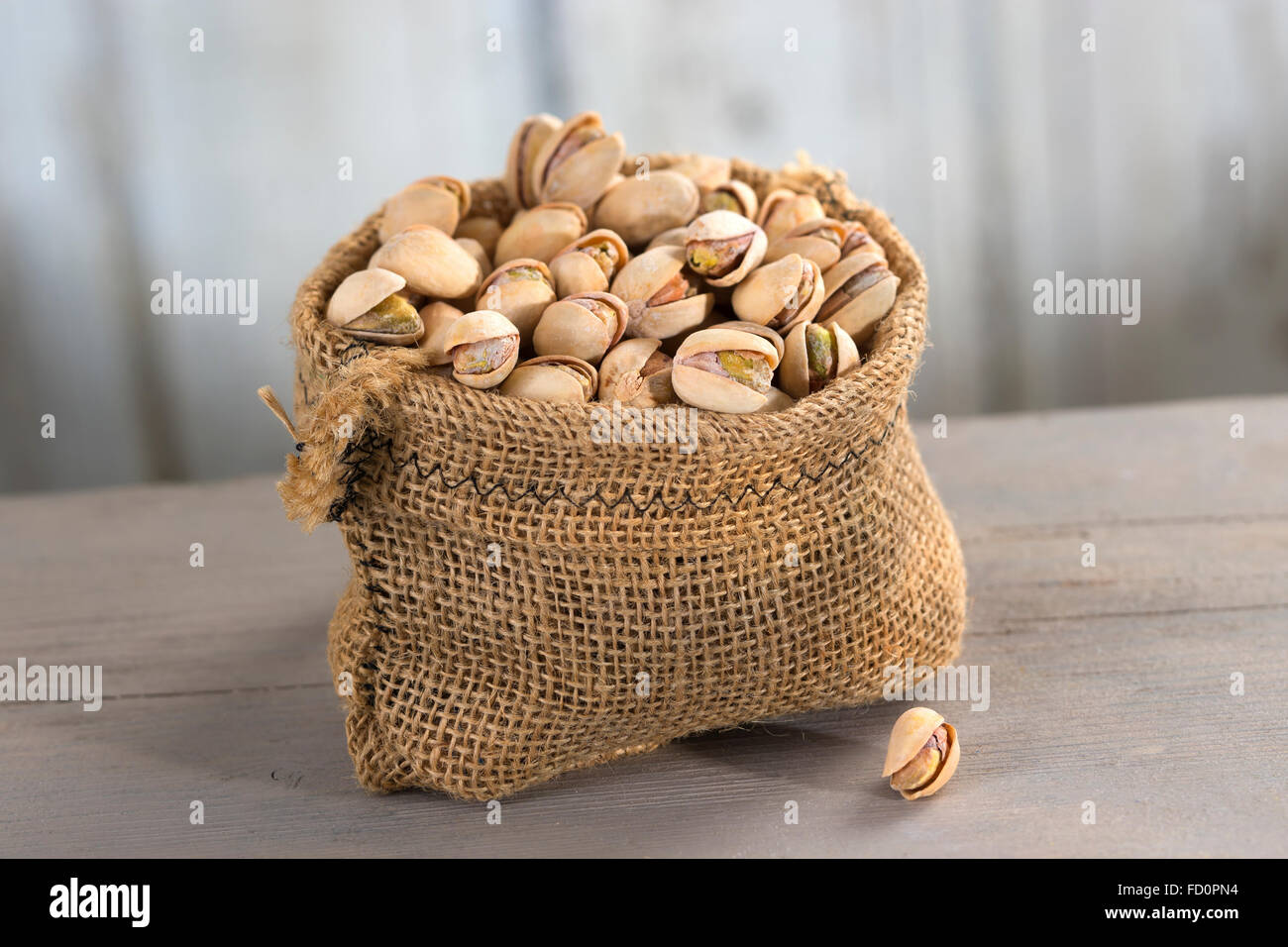 roasted salty pistachios nuts in burlap bag Stock Photo Alamy