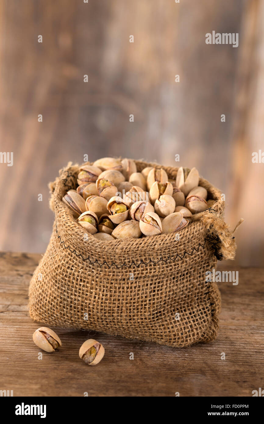 roasted salty pistachios nuts in burlap bag Stock Photo Alamy