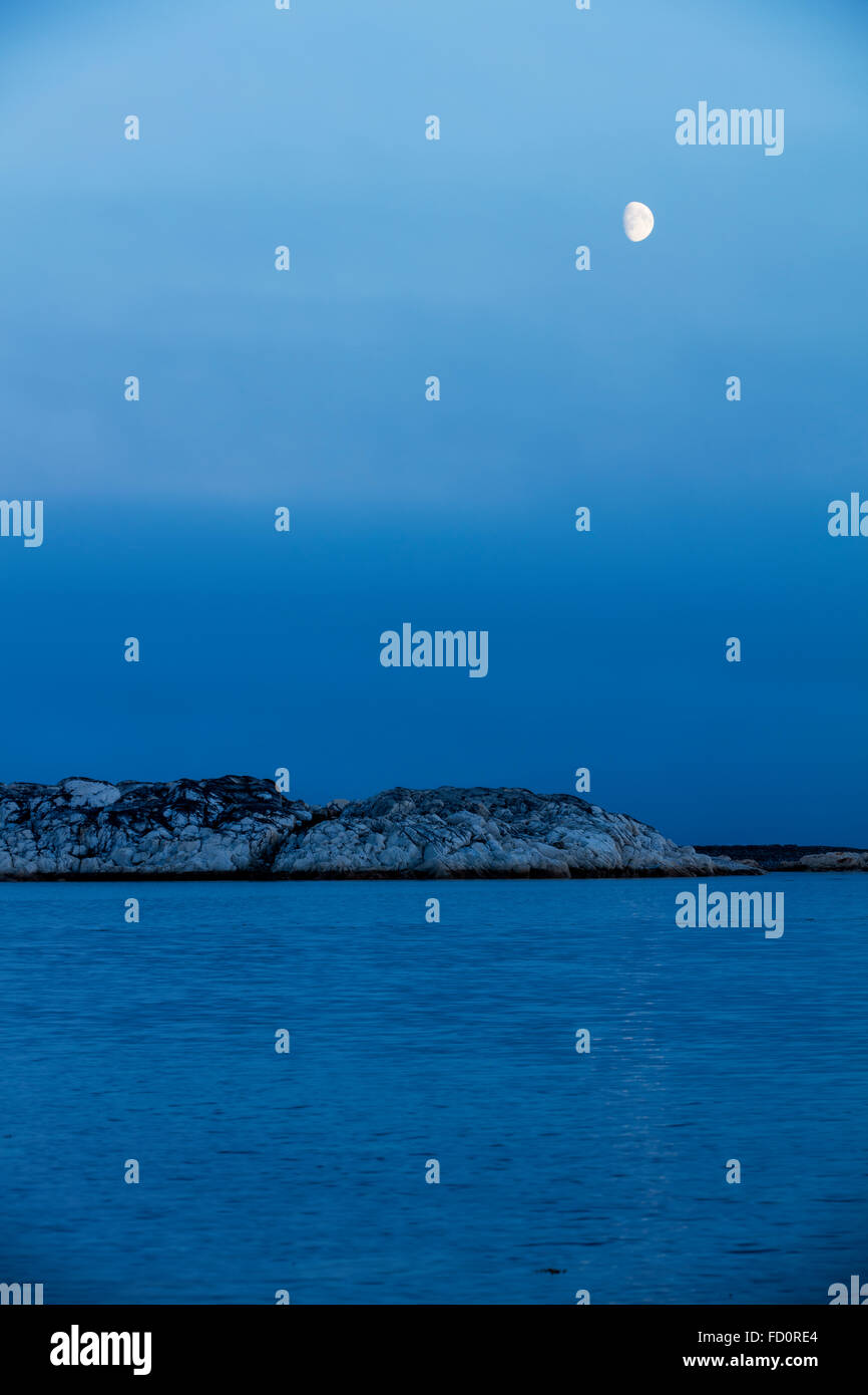 Canada, Nunavut Territory, Rankin Inlet, Moon sets above Marble Island