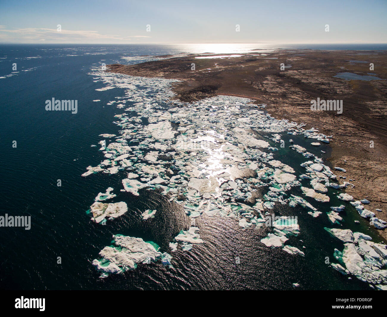 Canada, Nunavut Territory, Repulse Bay, Aerial view of grounded icebergs on southern shore of Repulse Bay along Hudson Bay on su Stock Photo