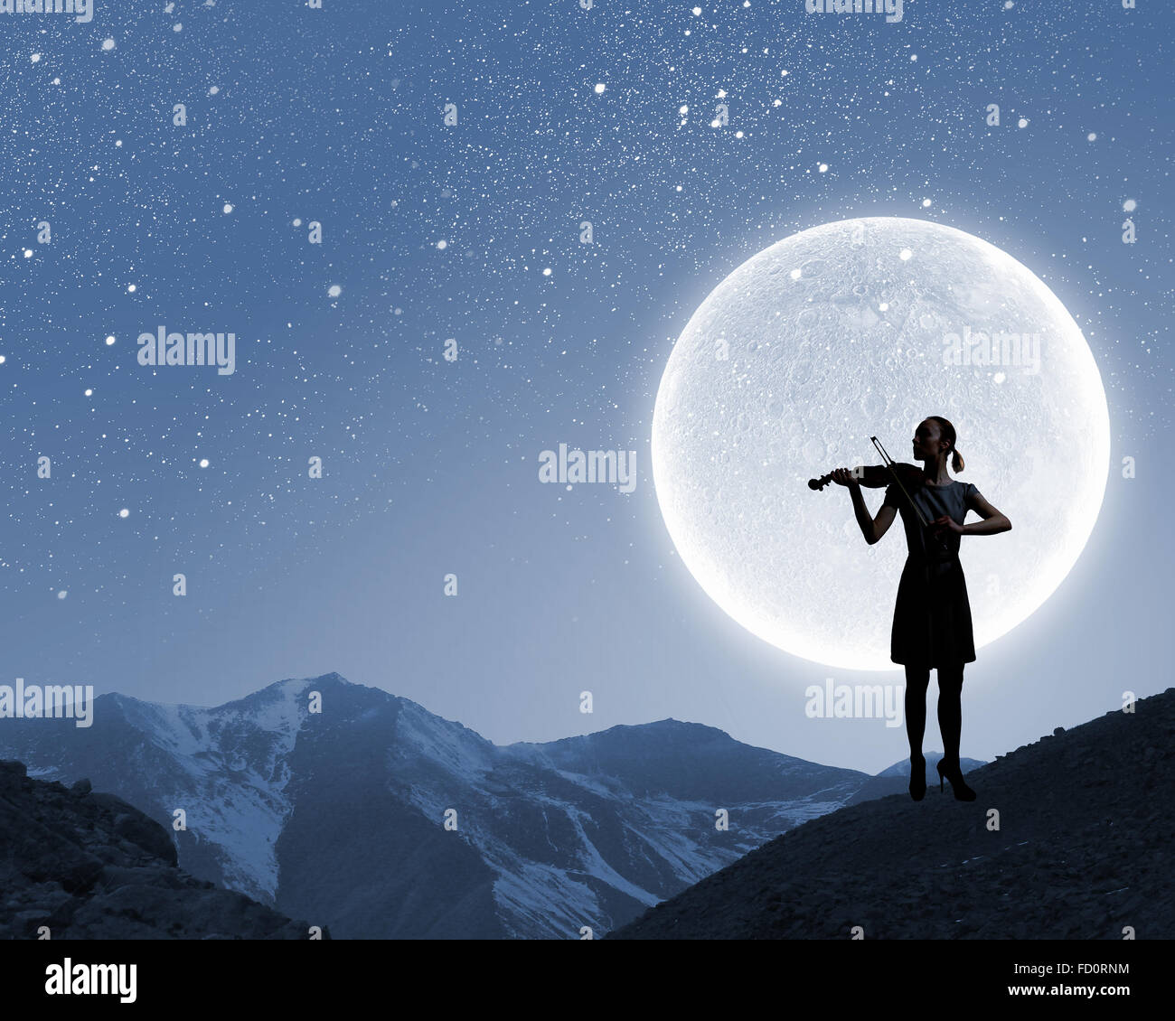 Silhouette of woman playing violin at night Stock Photo - Alamy