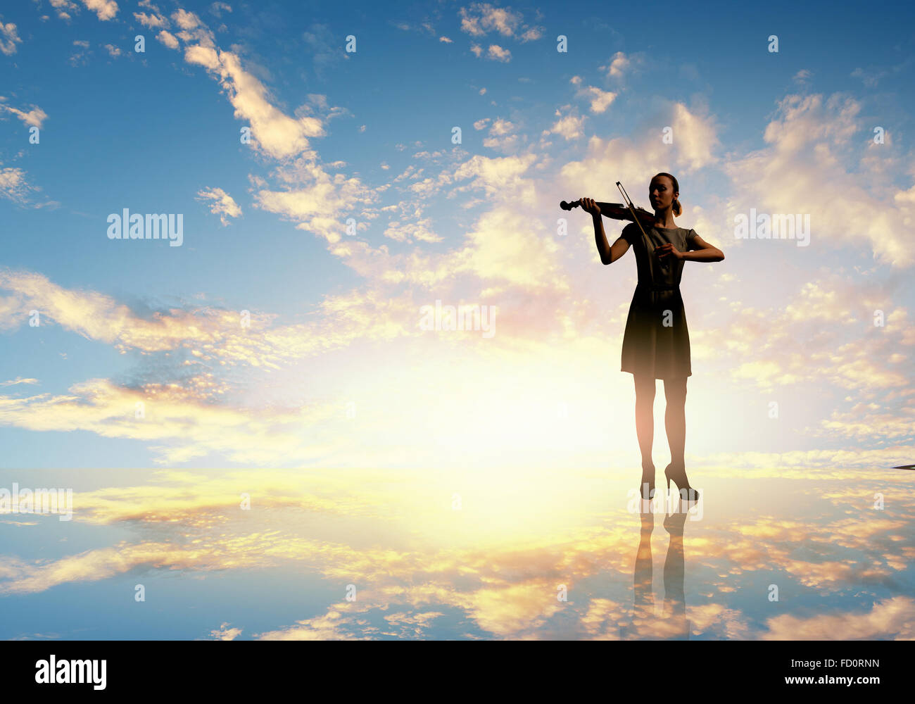 Silhouette of woman playing violin at sunset Stock Photo - Alamy